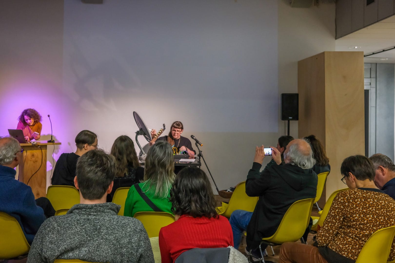 Adriana Knouf performing the opening of her lecture performance on her satellite dish instrument, Venus